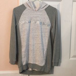 a grey sweatshirt.
